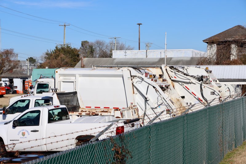 Part of the City of Lewes trash truck fleet parked at its Schley Avenue lot Dec. 16. Mayor and city council unanimously approved the purchase of a new trash truck for $300,000. BILL SHULL PHOTOS